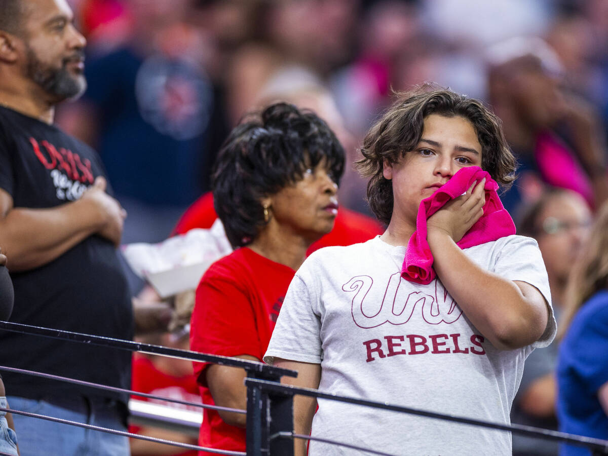 A UNLV fan appears dejected as the Syracuse Orange score again during the first half of their N ...