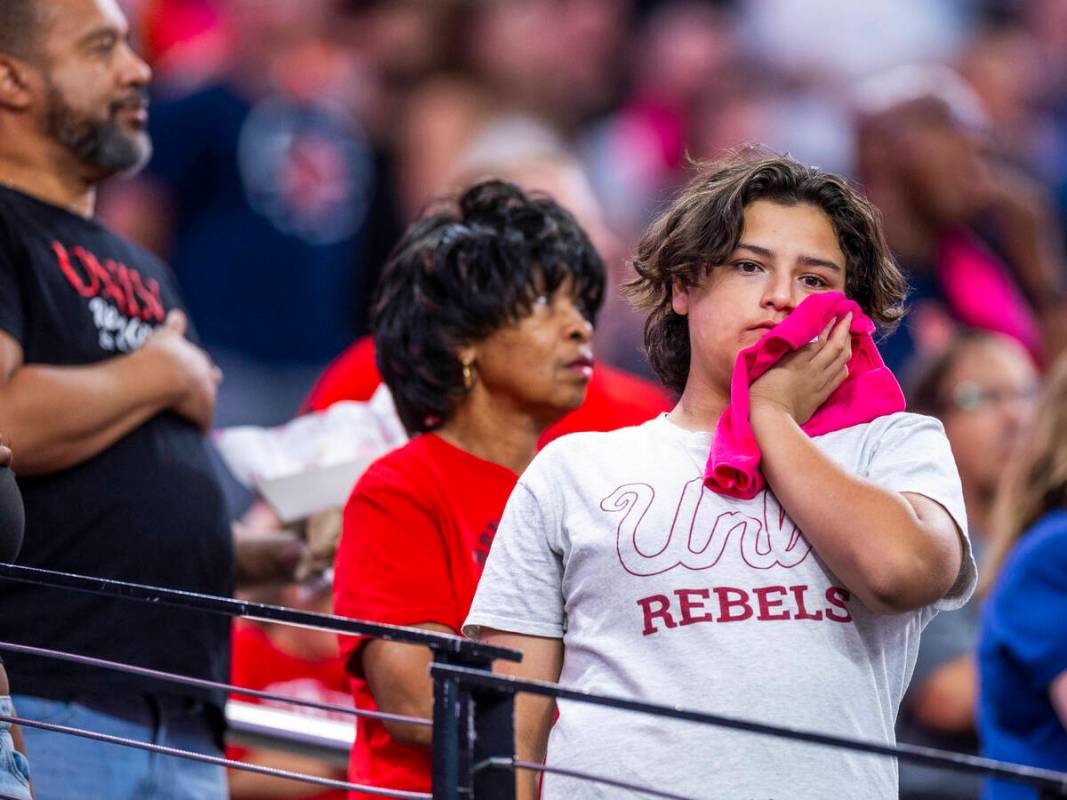 A UNLV fan appears dejected as the Syracuse Orange score again during the first half of their N ...