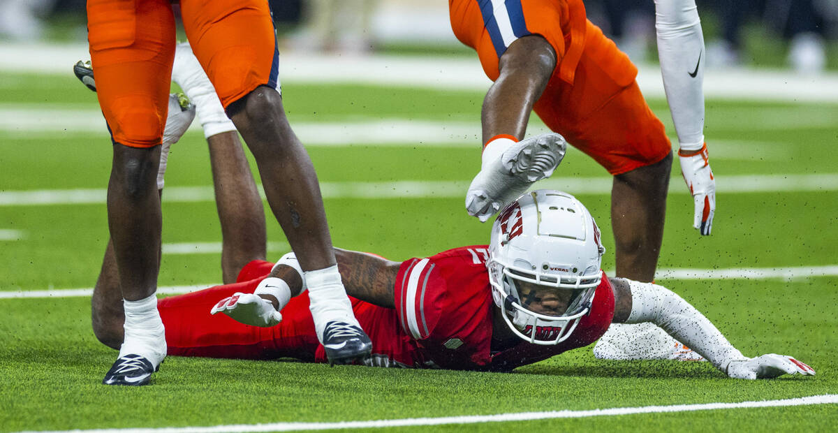 UNLV wide receiver Jaden Bradley (23) hits the turf hard after missing a long pass against the ...