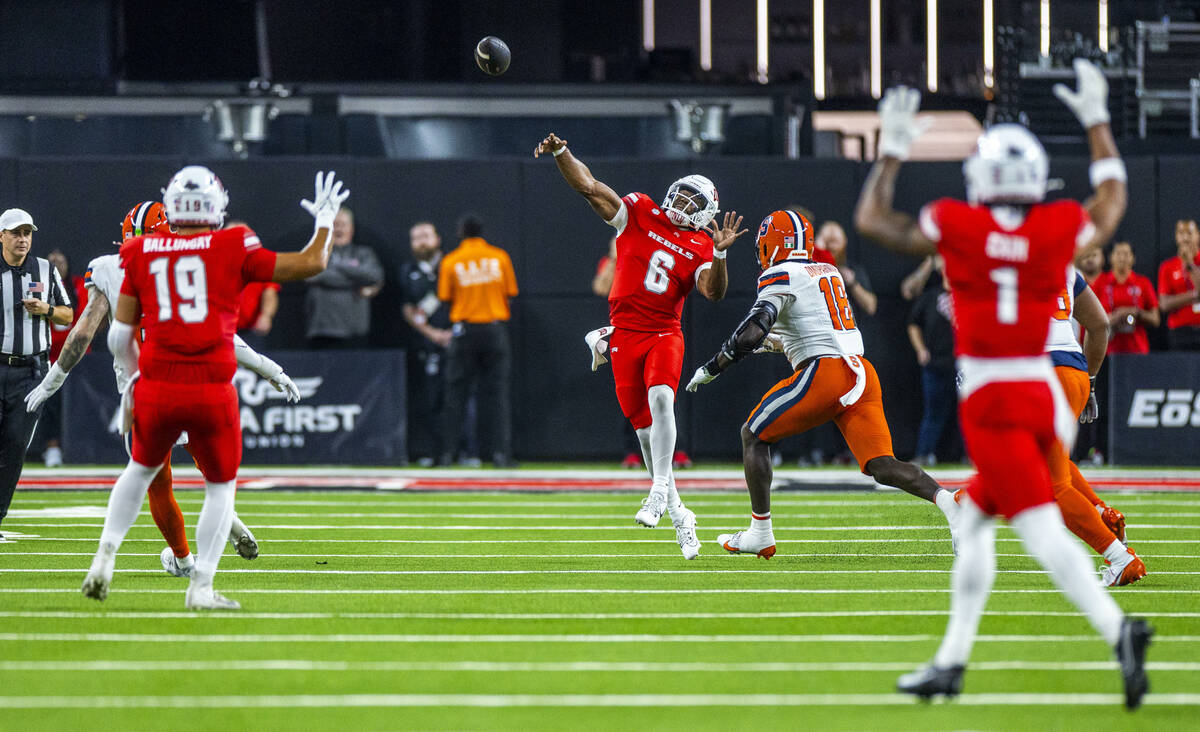 UNLV quarterback Hajj-Malik Williams (6) gets off a long pass as Syracuse Orange linebacker Dav ...