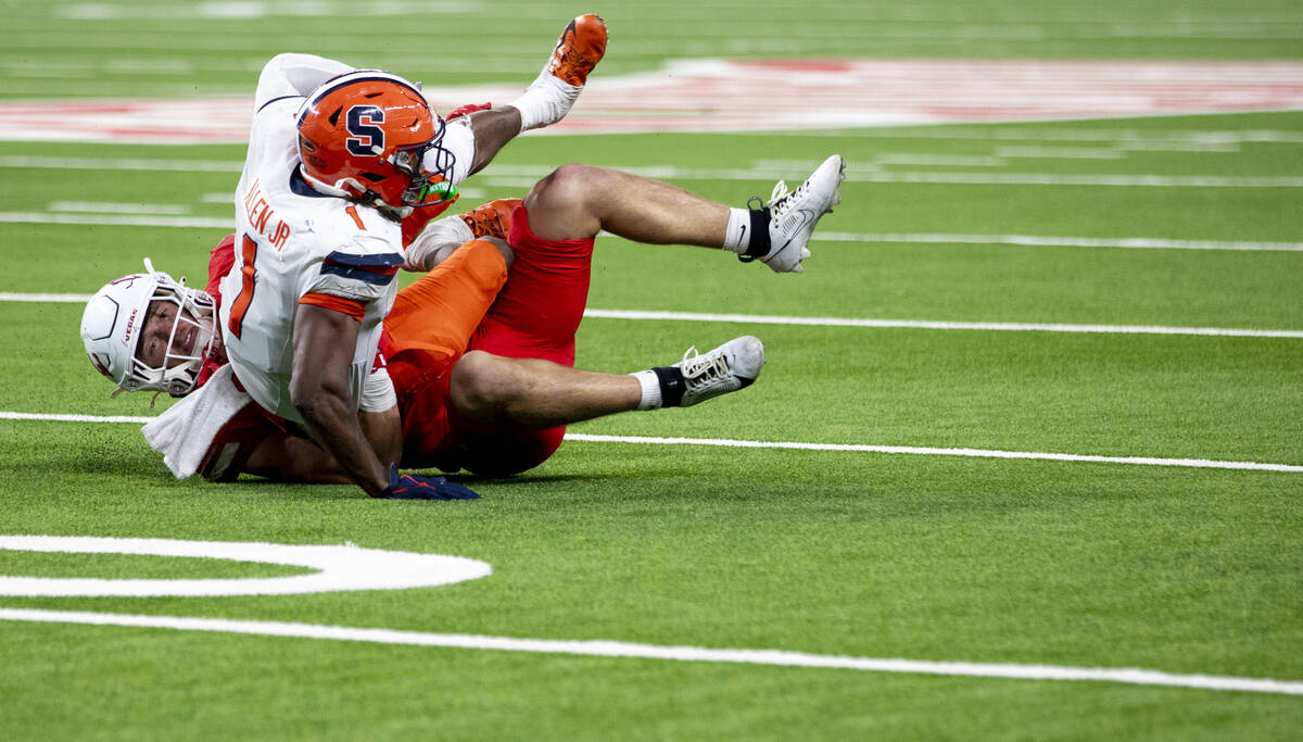 UNLV linebacker Jackson Woodard (7) tackles Syracuse Orange running back LeQuint Allen Jr. (1) ...