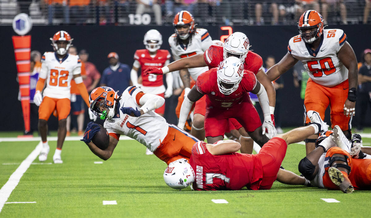 Syracuse Orange running back LeQuint Allen Jr. (1) attempts to stretch for a first down but is ...