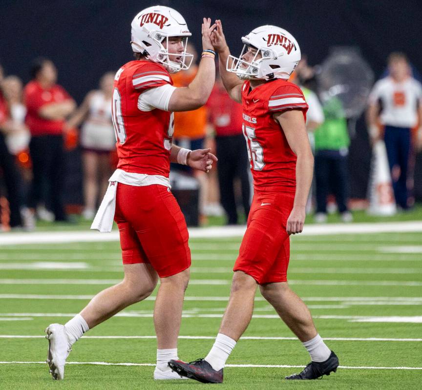 UNLV punter Marshall Nichols (90) and UNLV place kicker Caden Chittenden (45) celebrate a field ...