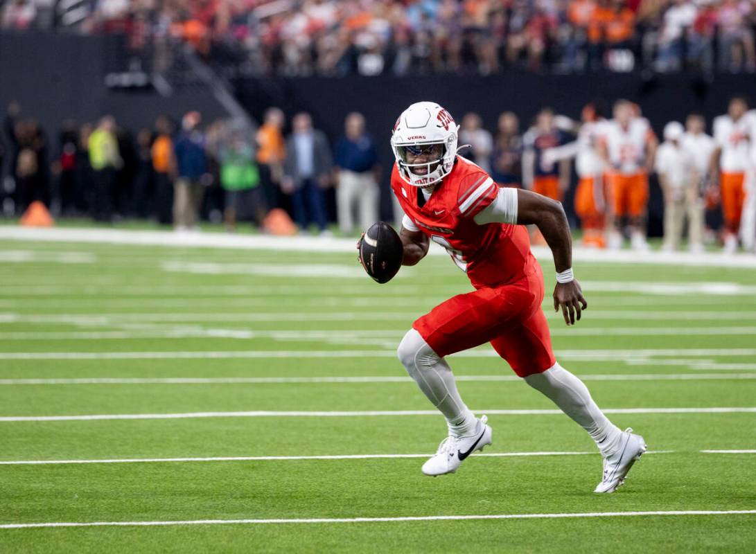 UNLV quarterback Hajj-Malik Williams (6) runs with the ball during the college football game ag ...