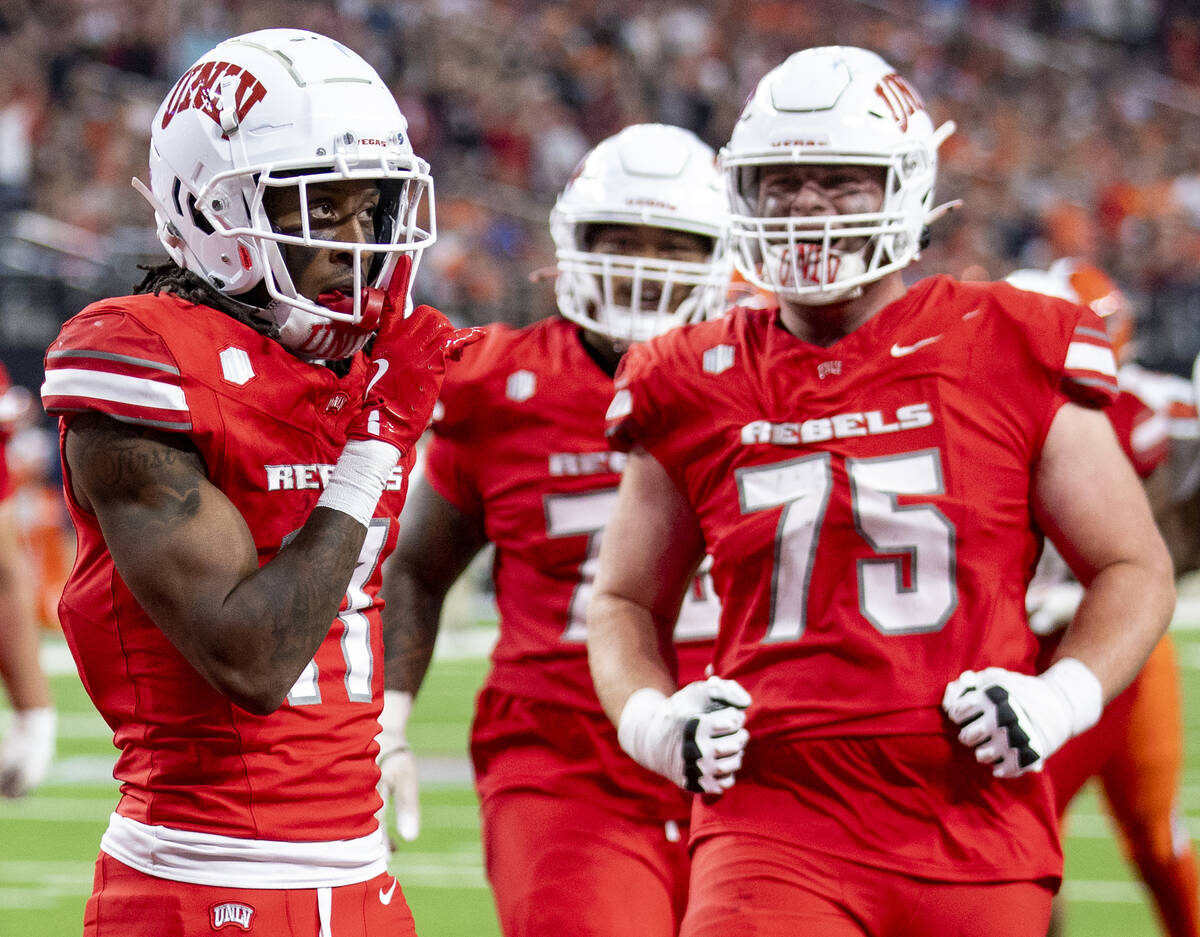 UNLV wide receiver Ricky White III (11) celebrates after scoring a touchdown during the college ...