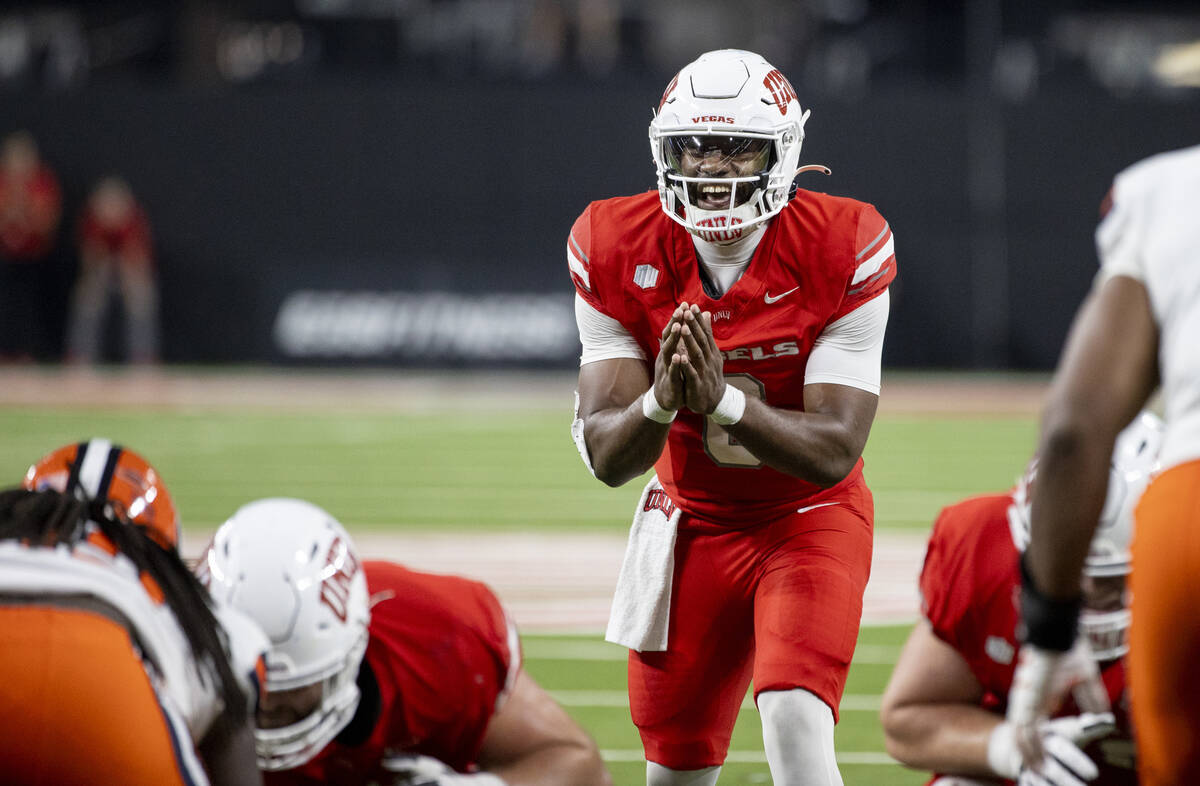 UNLV quarterback Hajj-Malik Williams (6) snaps the ball during the college football game agains ...