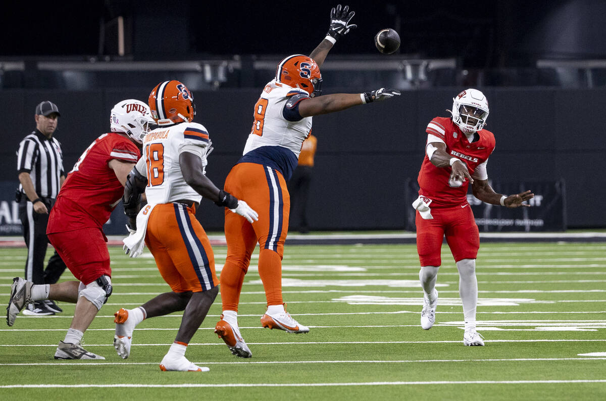 UNLV quarterback Hajj-Malik Williams (6) throws the ball during the college football game again ...