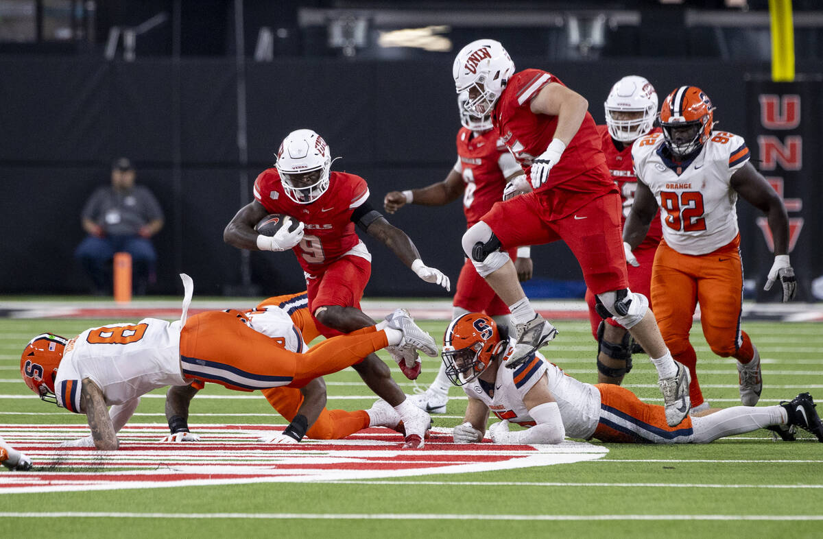 UNLV running back Jai'Den Thomas (9) runs the ball during the college football game against the ...