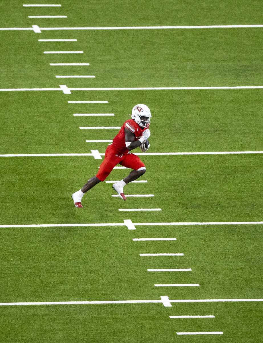 UNLV running back Jai'Den Thomas (9) runs the ball during the college football game against the ...