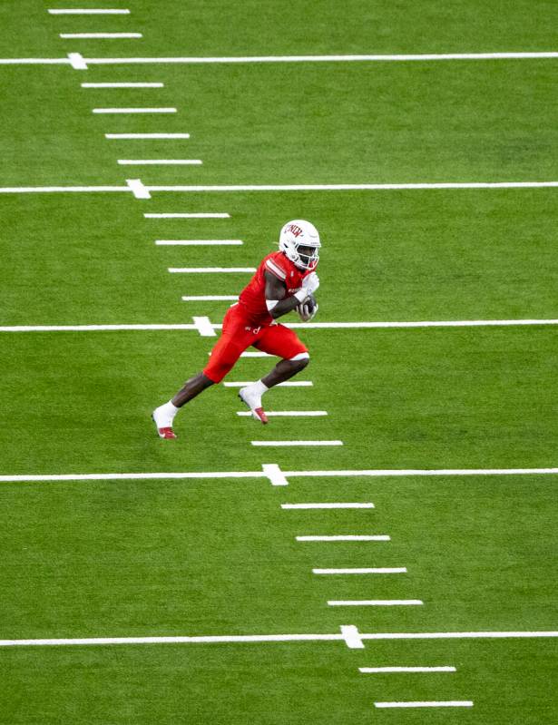 UNLV running back Jai'Den Thomas (9) runs the ball during the college football game against the ...