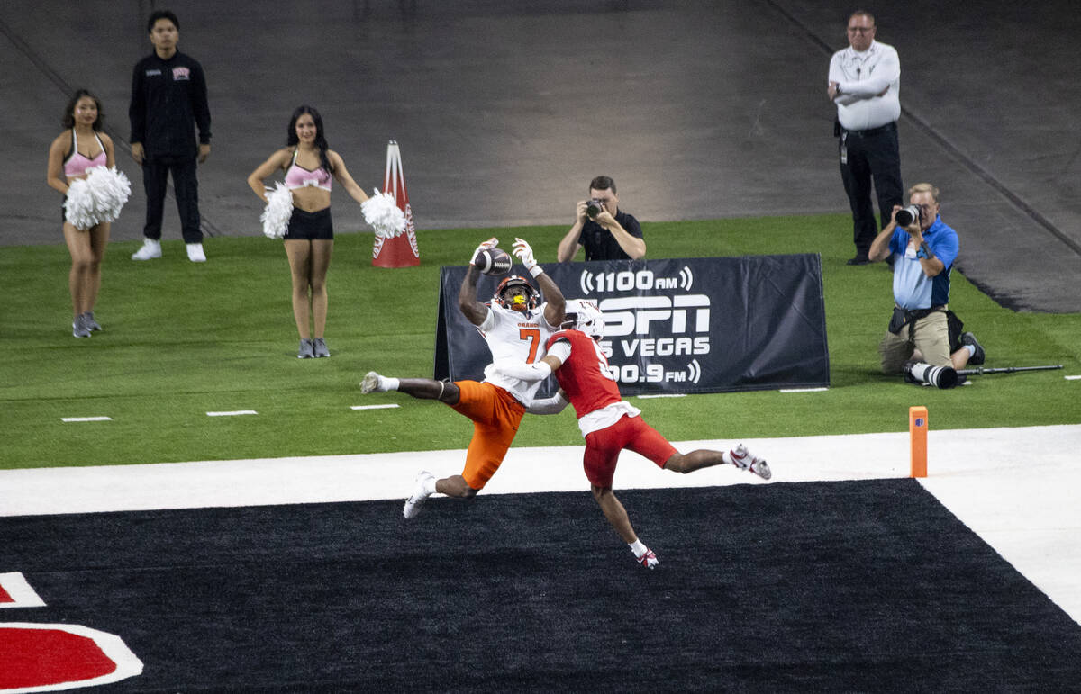 UNLV defensive back Cameron Oliver (5) interrupts a pass to Syracuse Orange wide receiver Jacks ...