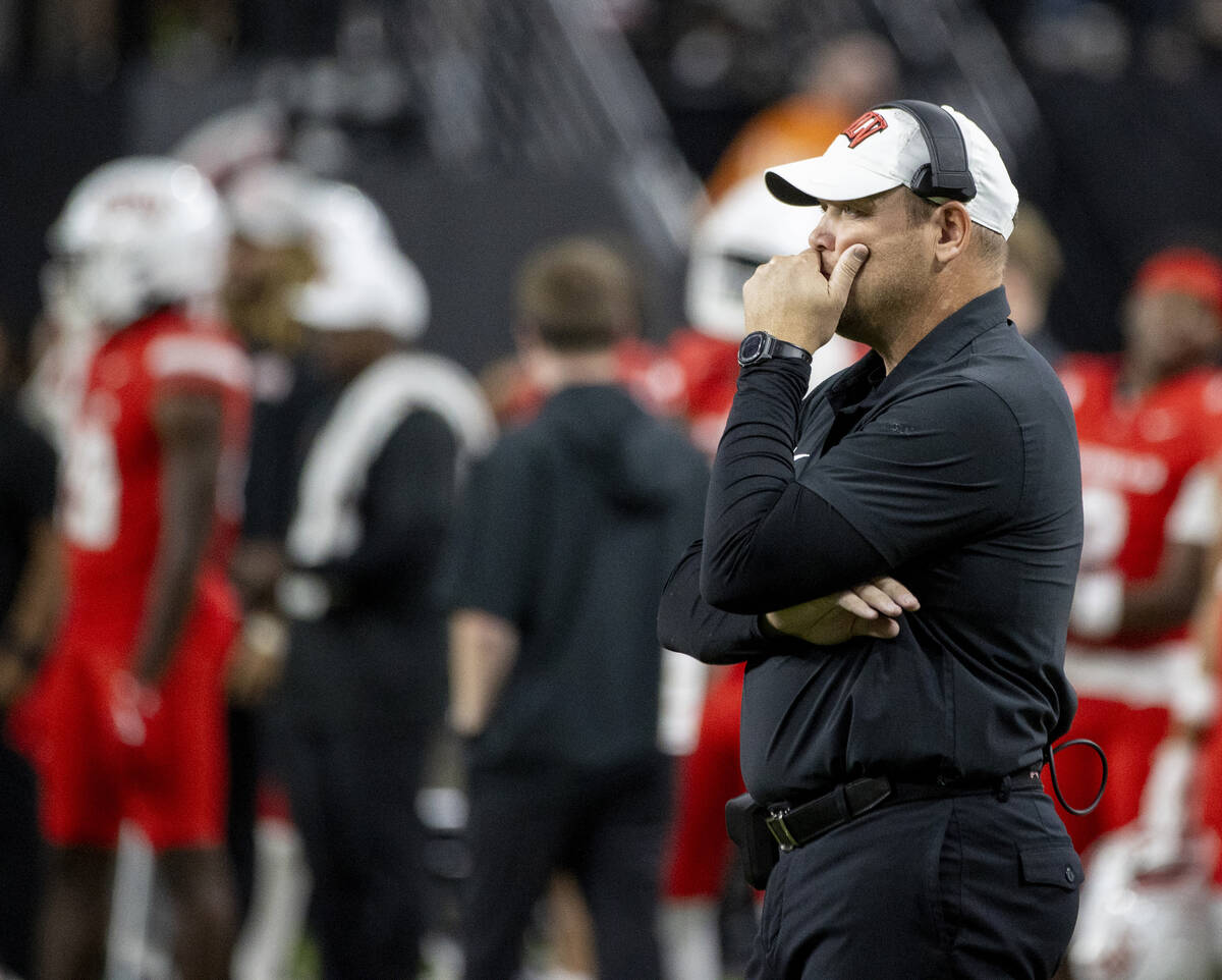 UNLV head coach Barry Odom talks on his headset during the college football game against the Sy ...