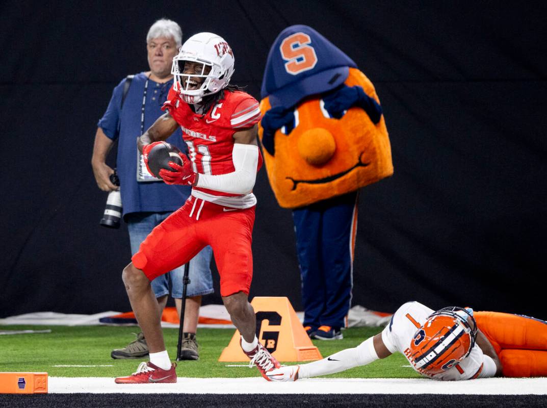 UNLV wide receiver Ricky White III (11) celebrates a big run during the college football game a ...