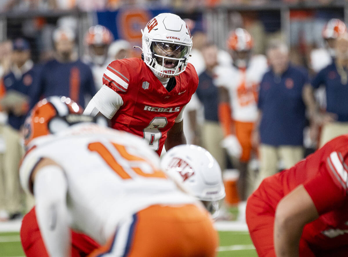 UNLV quarterback Hajj-Malik Williams (6) prepares to snap the ball during the college football ...