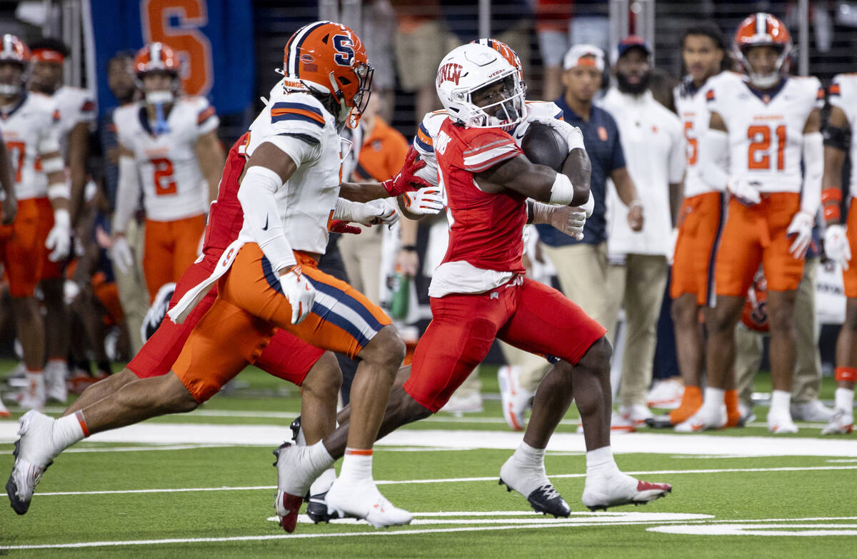 UNLV running back Jai'Den Thomas (9) runs the ball during the college football game against the ...