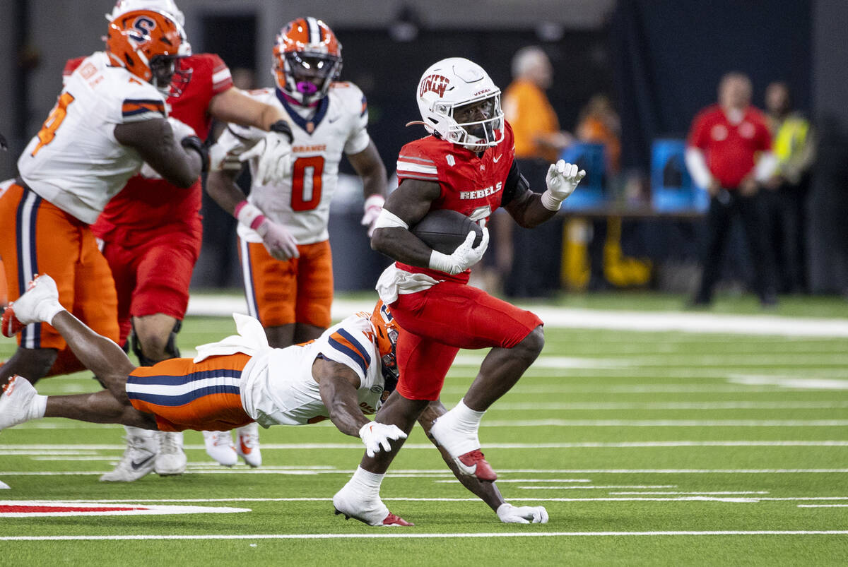 UNLV running back Jai'Den Thomas (9) runs the ball during the college football game against the ...