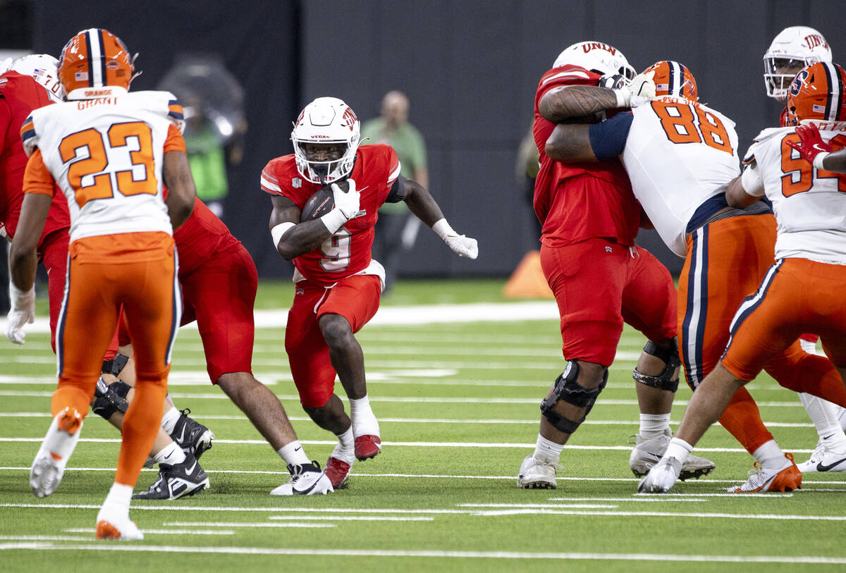 UNLV running back Jai'Den Thomas (9) runs the ball during the college football game against the ...