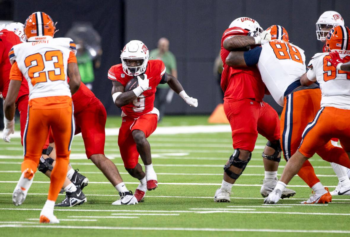 UNLV running back Jai'Den Thomas (9) runs the ball during the college football game against the ...