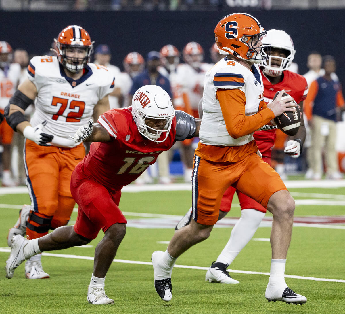 UNLV linebacker Mani Powell (16) attempts to tackle Syracuse Orange quarterback Kyle McCord (6) ...