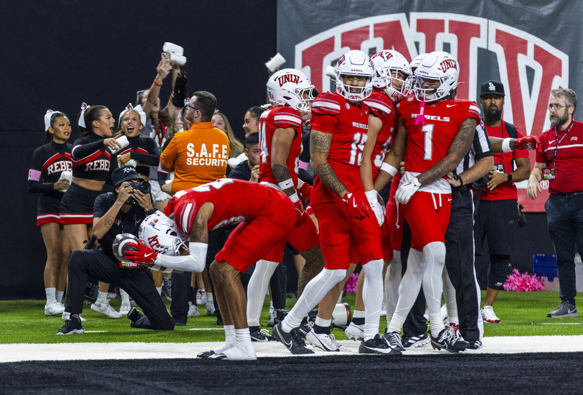 UNLV running back Kylin James (20) pounds the football into the turf in the end zone after a bl ...