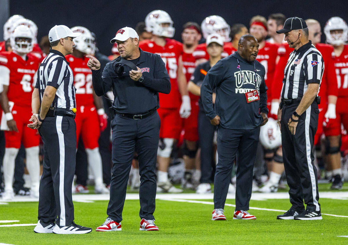 UNLV Head Coach Barry Odom argues a penalty with an official against the Syracuse Orange during ...