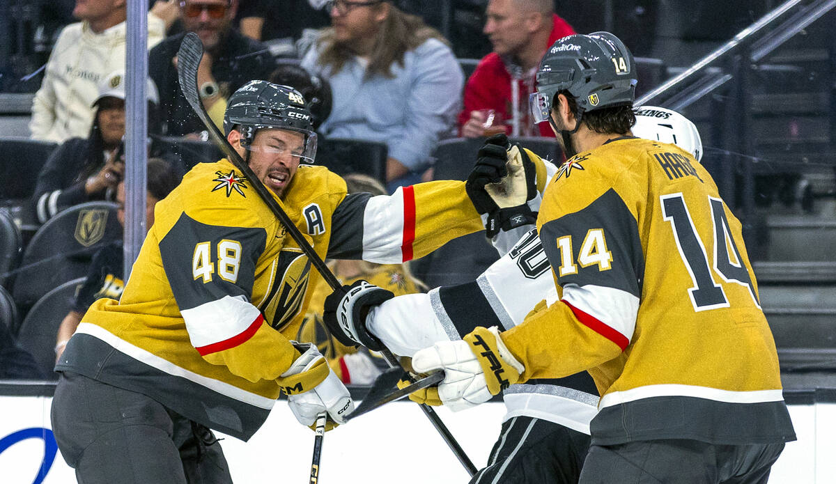 Golden Knights center Tomas Hertl (48) takes a high stick to the face from Los Angeles Kings le ...