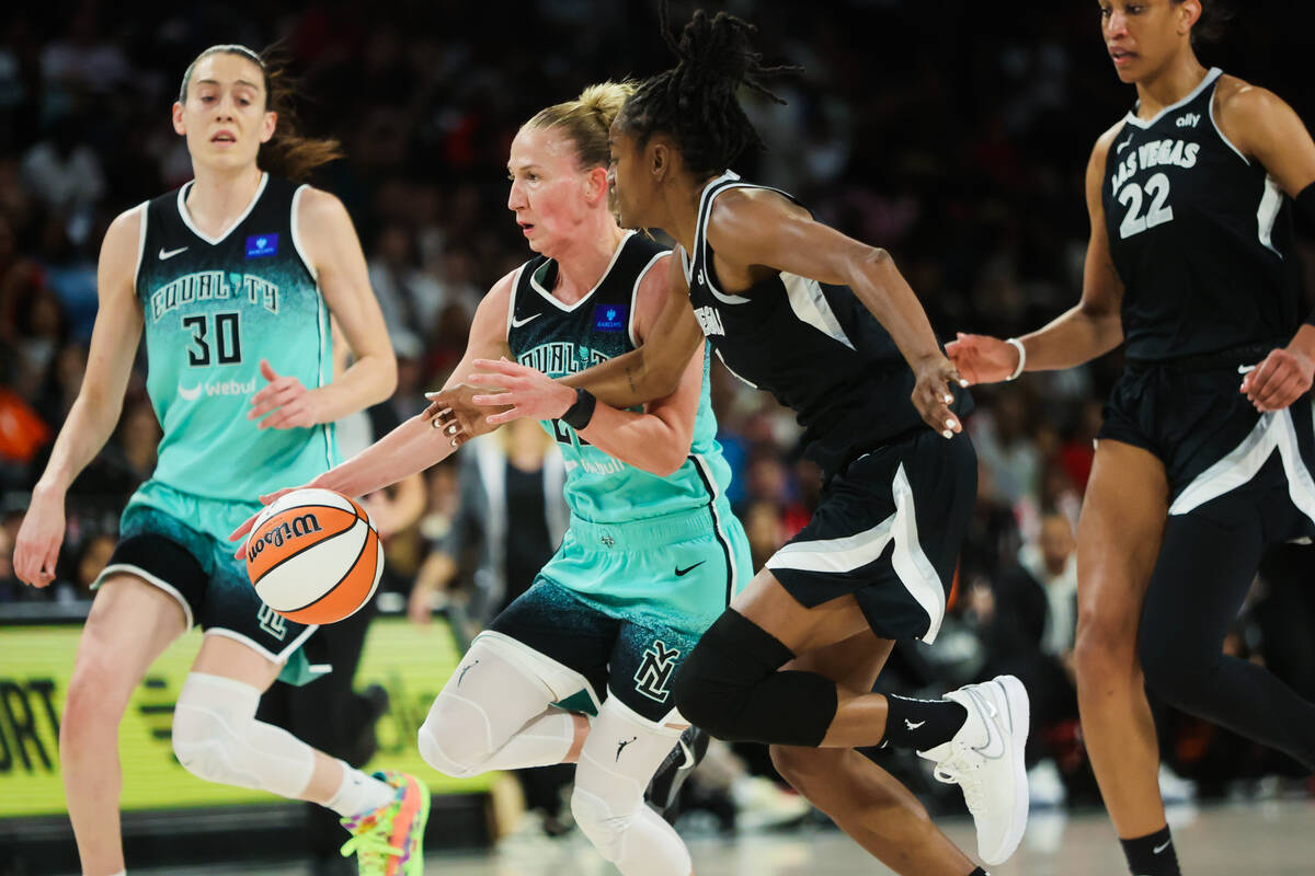 New York Liberty guard Courtney Vandersloot (22) dribbles the ball down the court as Aces guard ...