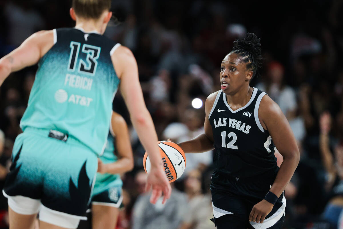 Aces guard Chelsea Gray (12) dribbles the ball down the court during game three of a WNBA semif ...