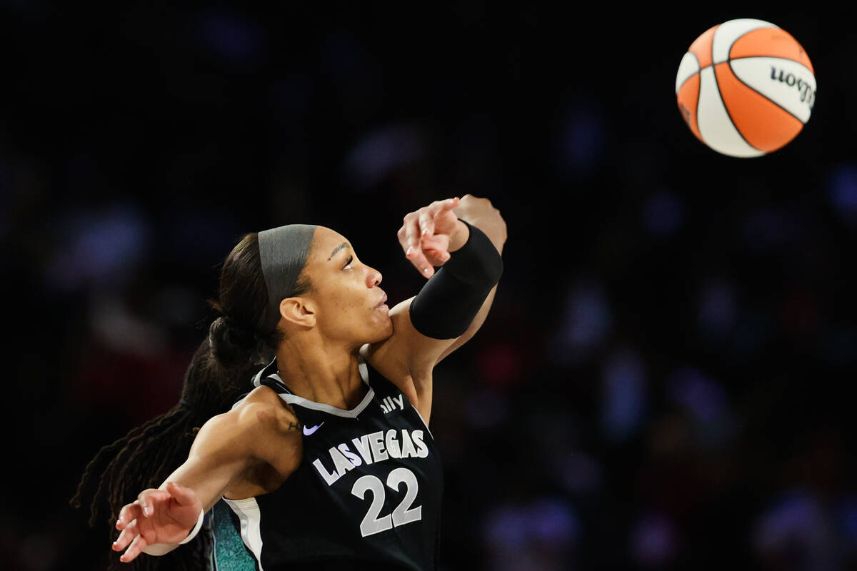 Aces center A'ja Wilson (22) reaches for the ball during a tip off at game three of a WNBA semi ...