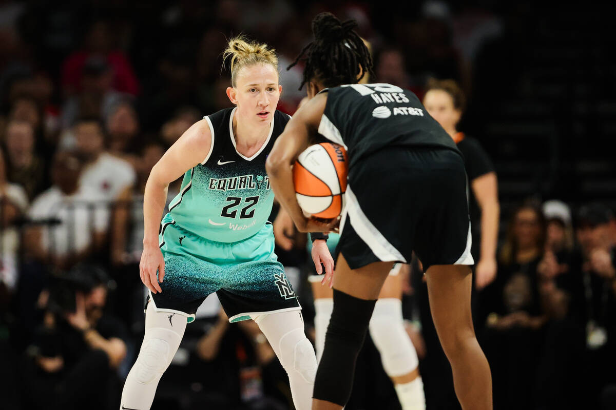 New York Liberty guard Courtney Vandersloot (22) guards Aces guard Tiffany Hayes (15) as she wa ...