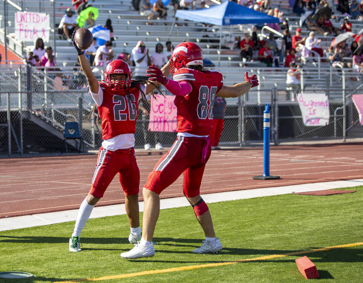 Arbor View running back Kaine Berry (26) celebrates a touchdown with tight end Zac Fares (88) d ...