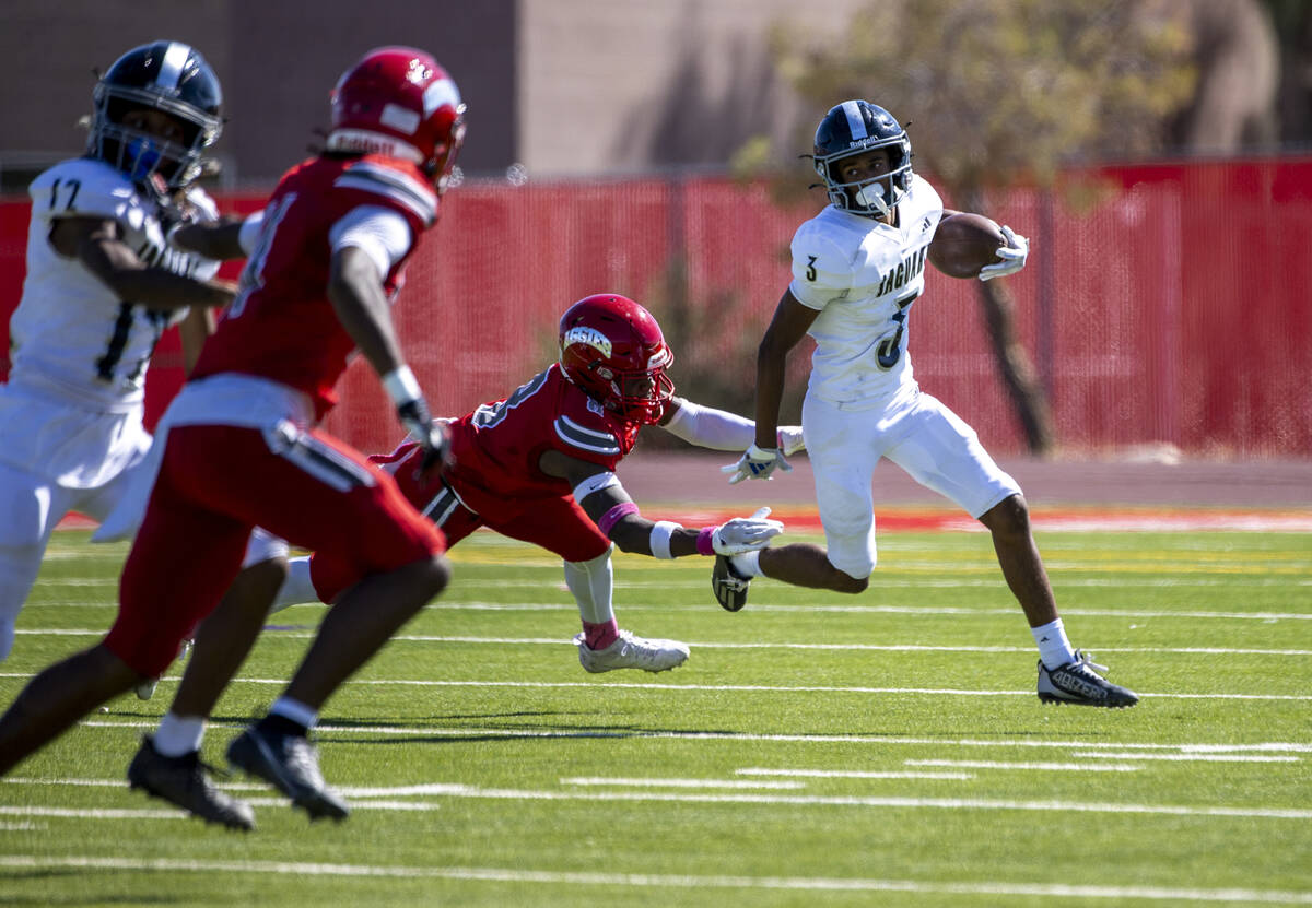 Desert Pines wide receiver Jaxon Sharp (3) runs with the ball during the high school football g ...