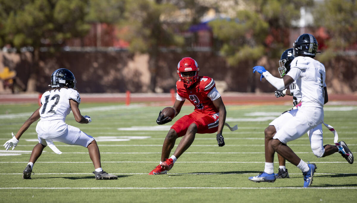 Arbor View wide receiver Damani Warren (3) runs with the ball during the high school football g ...