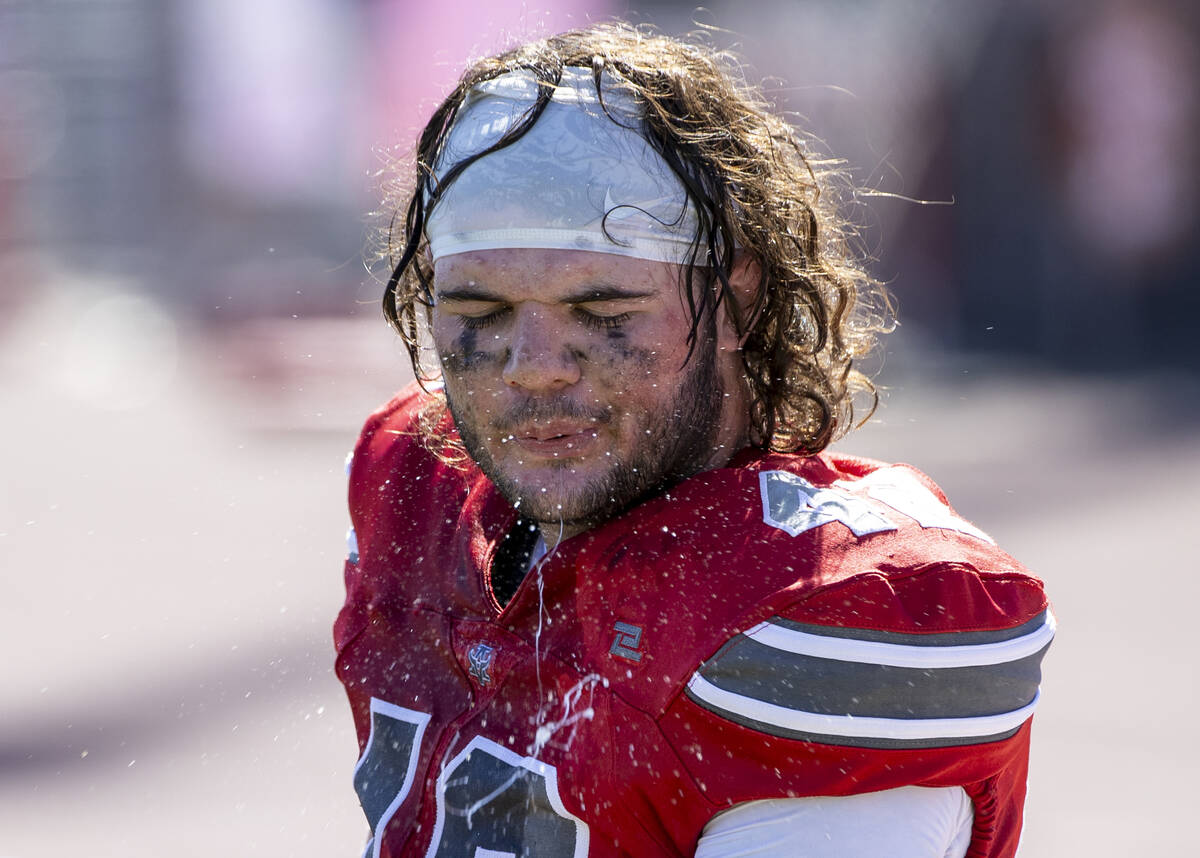 Arbor View linebacker Christian Thatcher (42) spits during the high school football game agains ...