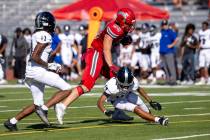 Arbor View tight end Zac Fares (88) makes a Desert Pines player miss during the high school foo ...