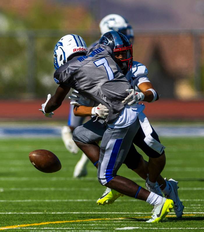 Basic running back Christopher McKenzie (7) drops a pass after a big hit from Coronado defensiv ...