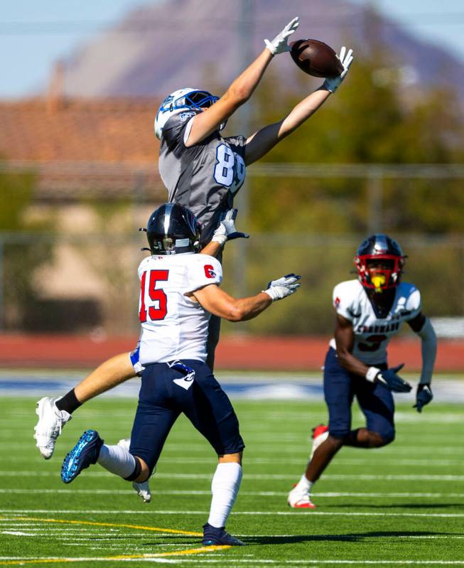 Basic wide receiver Hunter McGory (89) elevates for a reception attempt as Coronado linebacker ...