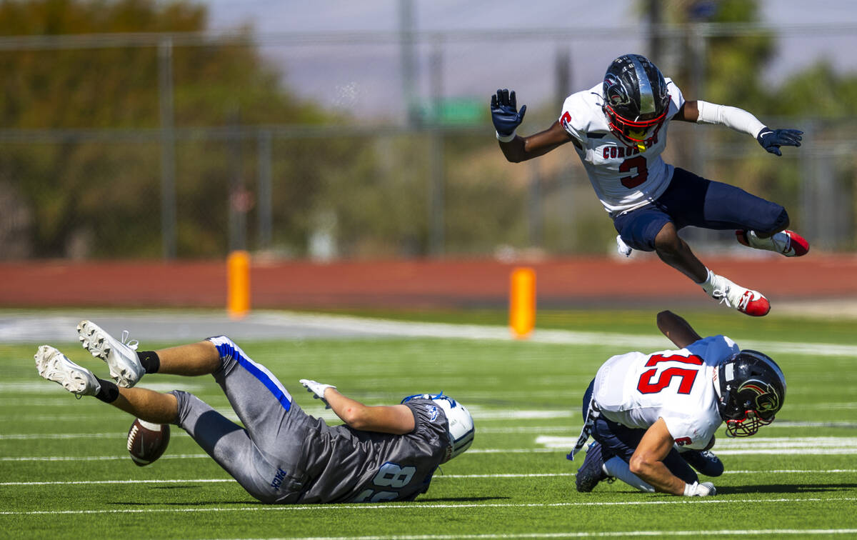 Basic wide receiver Hunter McGory (89) loses a reception attempt as Coronado linebacker Kael Fr ...