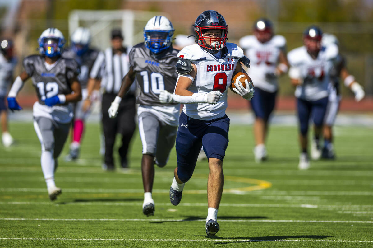 Coronado tight end Neville Roberts (8) sprints up the field after a reception with Basic safety ...