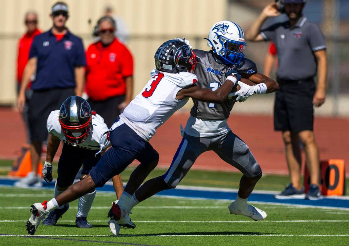 Basic running back Donovan Glover (1) attempts to break a tackle by Coronado defensive back Ty ...