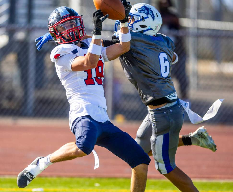 Coronado wide receiver Landon Sanford (19) secures a touchdown pas under tight coverage by Basi ...