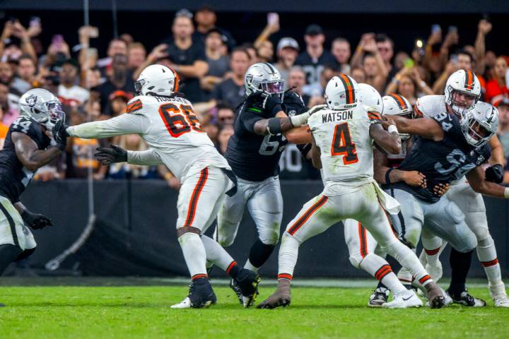 Cleveland Browns quarterback Deshaun Watson (4) is flushed from the pocked by defensive tackle ...