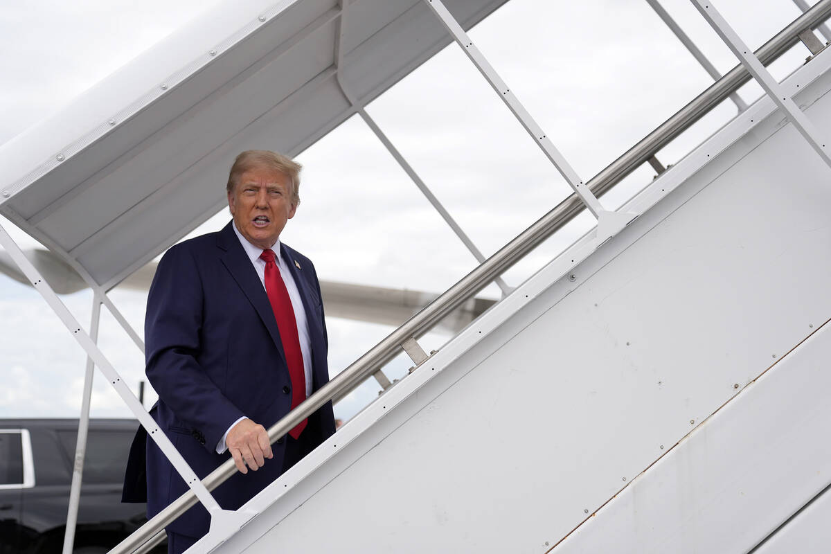 Republican presidential nominee former President Donald Trump boards his plane at West Palm Bea ...