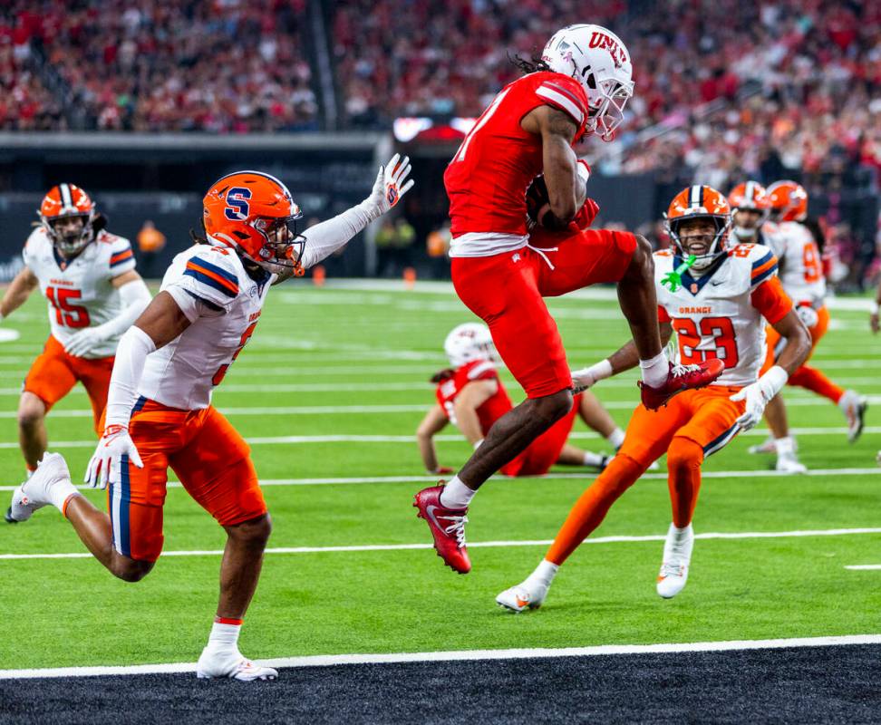 UNLV wide receiver Ricky White III (11) secures a touchdown reception over Syracuse Orange defe ...