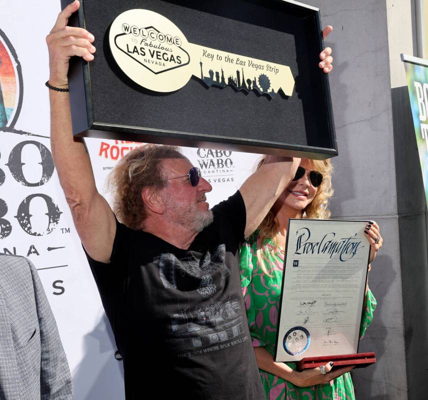 Sammy Hagar shows his Key to the Las Vegas Strip as his wife Kari Hagar looks on during a cerem ...