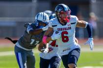 Coronado defensive back JJ Buchanan (6) brushes off a tackle attempt after an interception by B ...