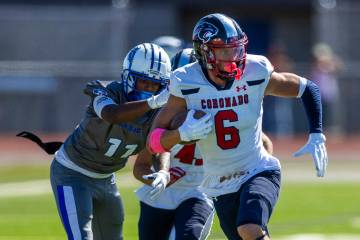 Coronado defensive back JJ Buchanan (6) brushes off a tackle attempt after an interception by B ...