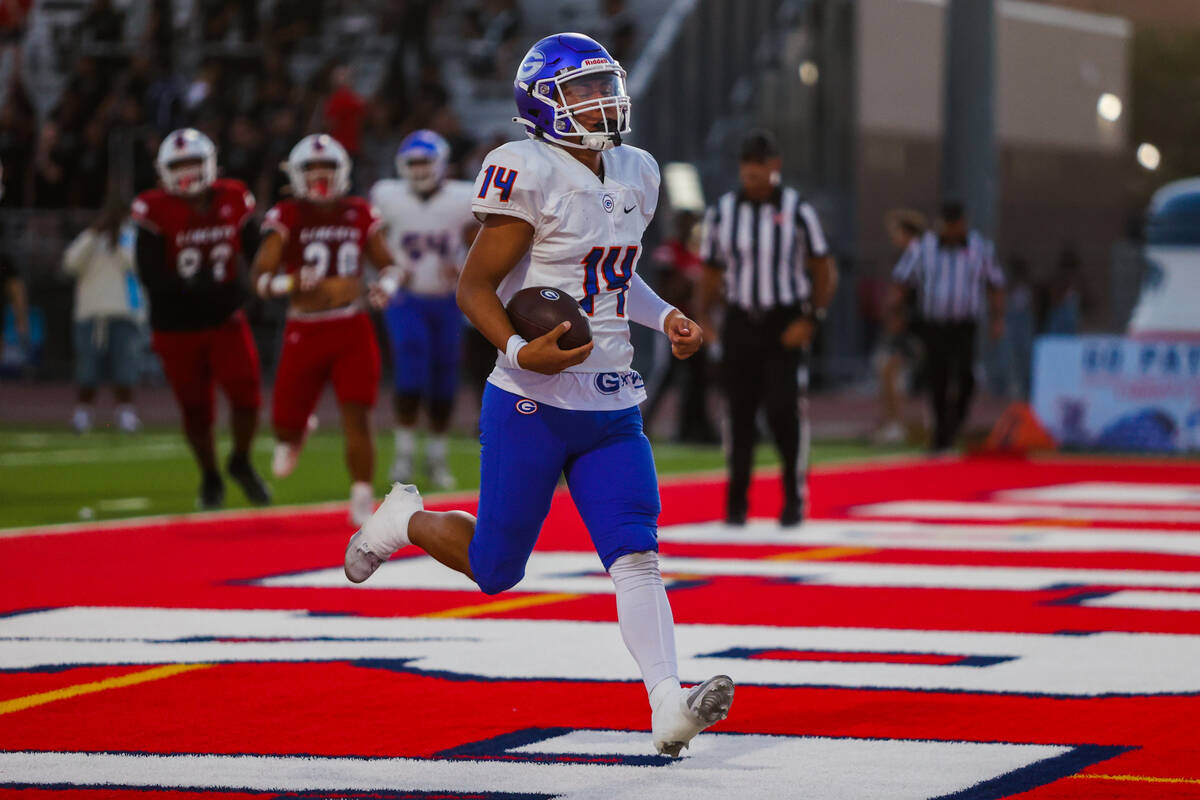 Bishop Gorman quarterback Maika Eugenio runs into the end zone for a touchdown during a high sc ...