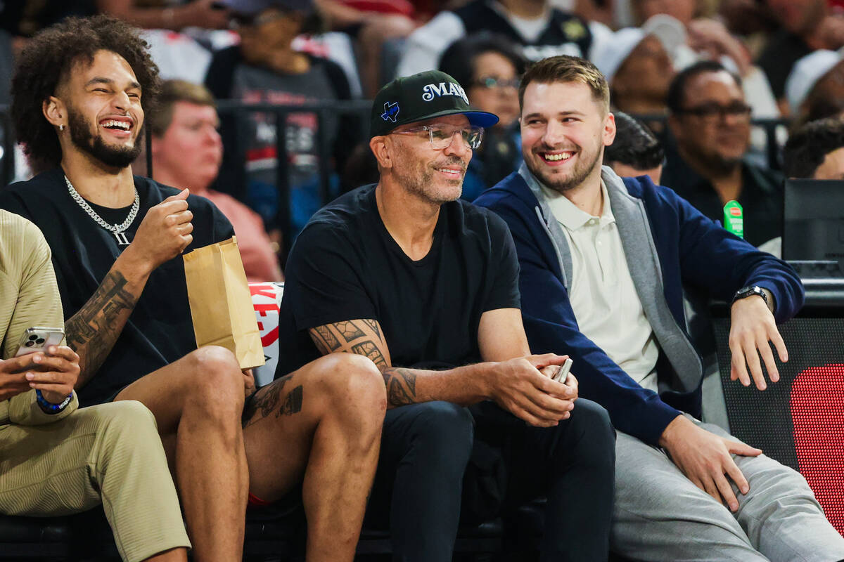 Dallas Mavericks center Dereck Lively, from left, Mavericks head coach Jason Kidd, and Maverick ...