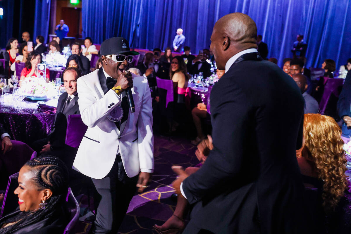 Flavor Flav, left, jokes around with Terry Crews during the Paid in Full Foundation’s Hi ...